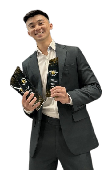 Fabian Sim holding his awards